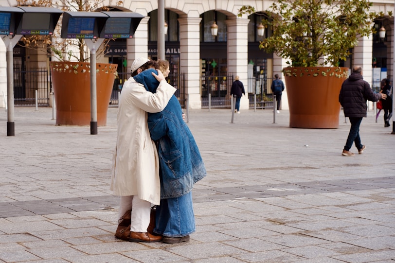 Couple embracing in a public square