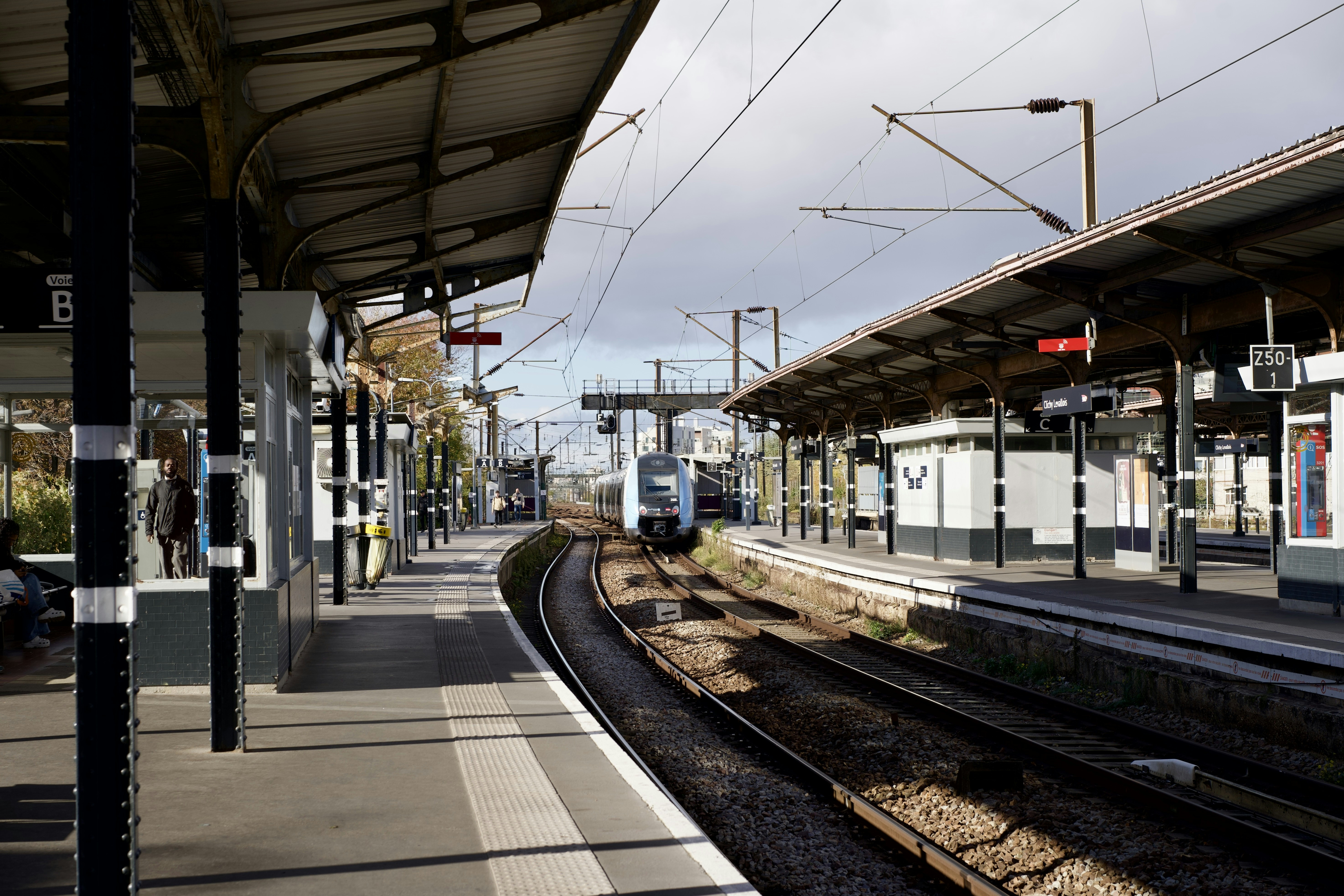 Train approaching an empty station platform
