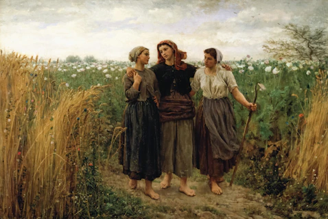 Three women walking through a field of flowers