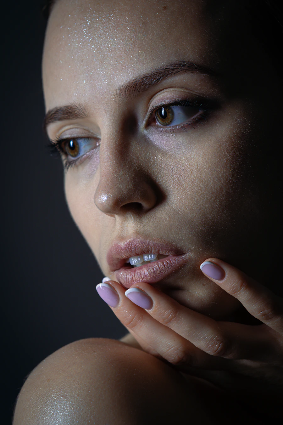 Woman touching her chin while considering treatment areas