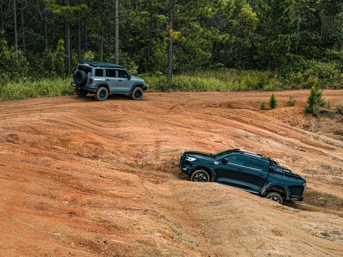 Two 4WD vehicles exploring a sandy bush track in the Glass House Mountains, Queensland; photograph by 4wheelhouse