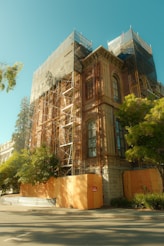 Historic building undergoing renovation with scaffolding.