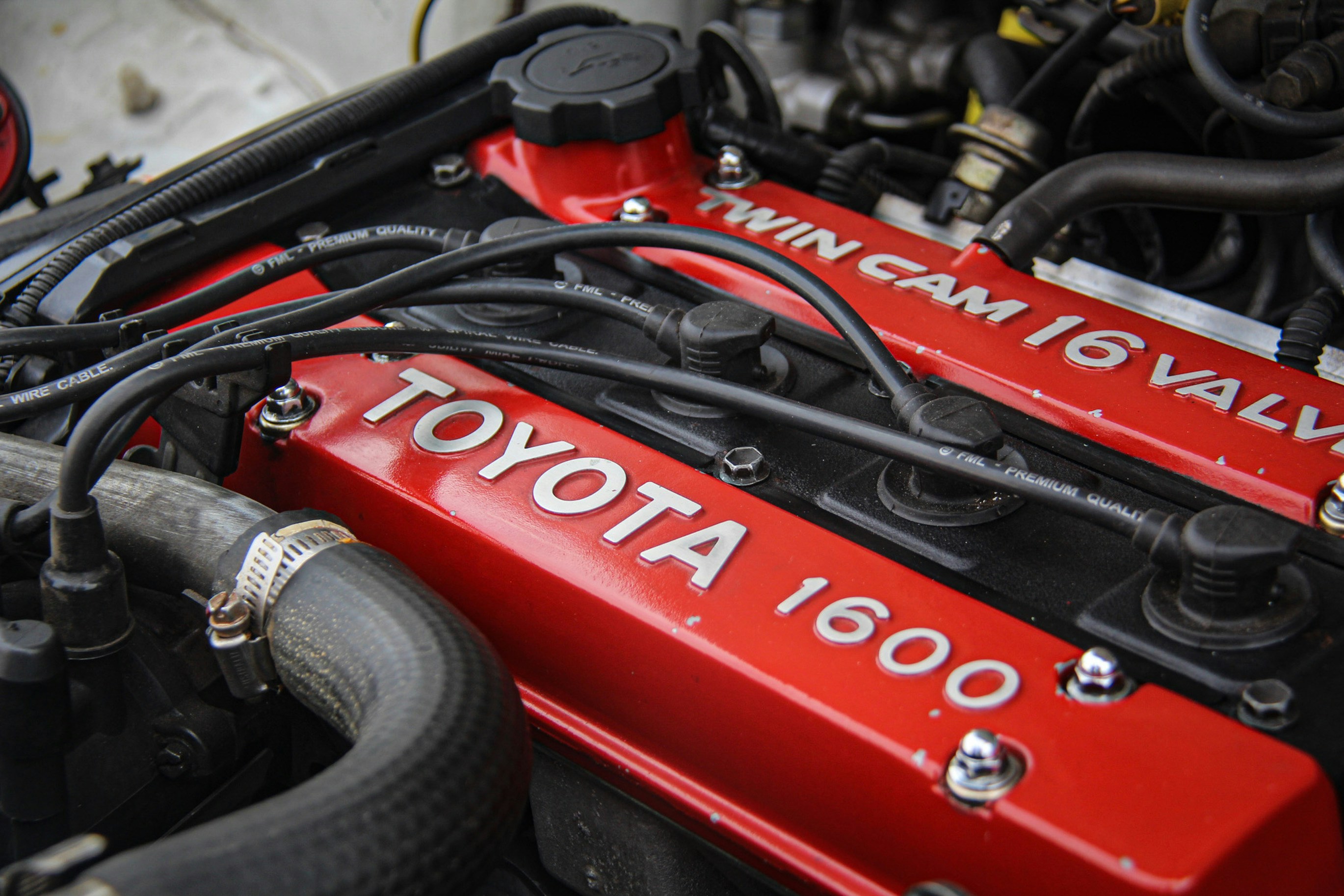 Close-up of a red toyota 1600 twin cam engine
