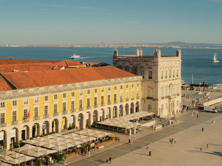 Praça do Comércio yellow building in Lisbon overlooking the Tagus River