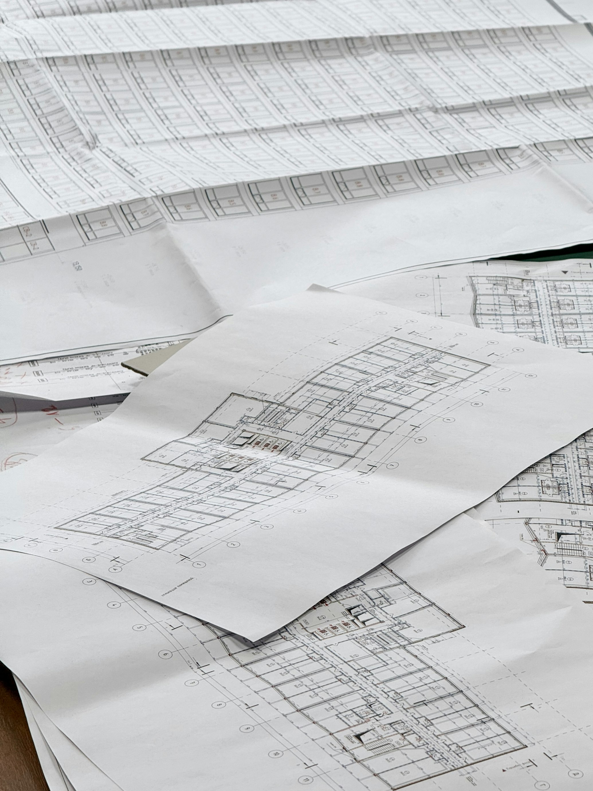 Architectural blueprints and construction planning materials on a desk