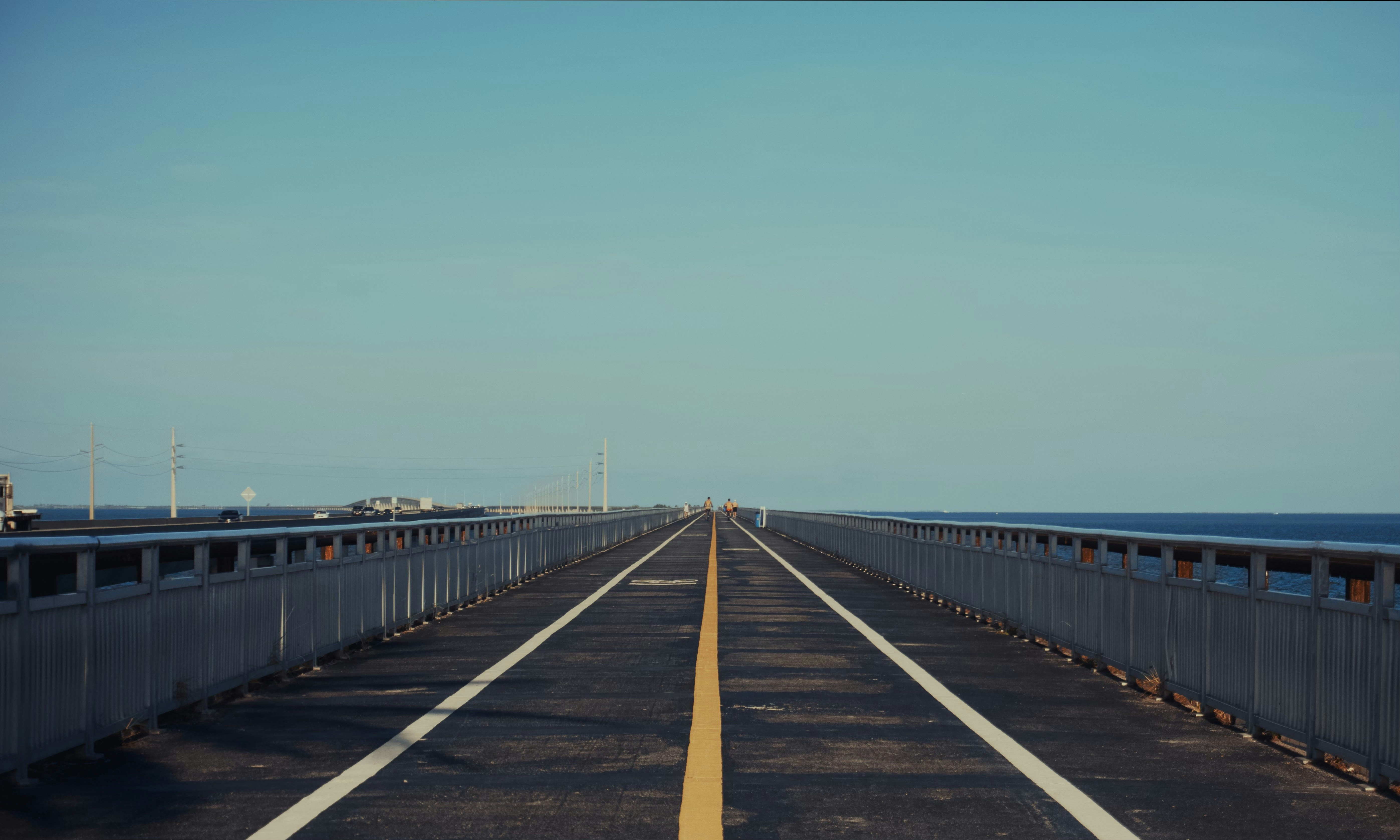 A long straight road stretches towards the horizon