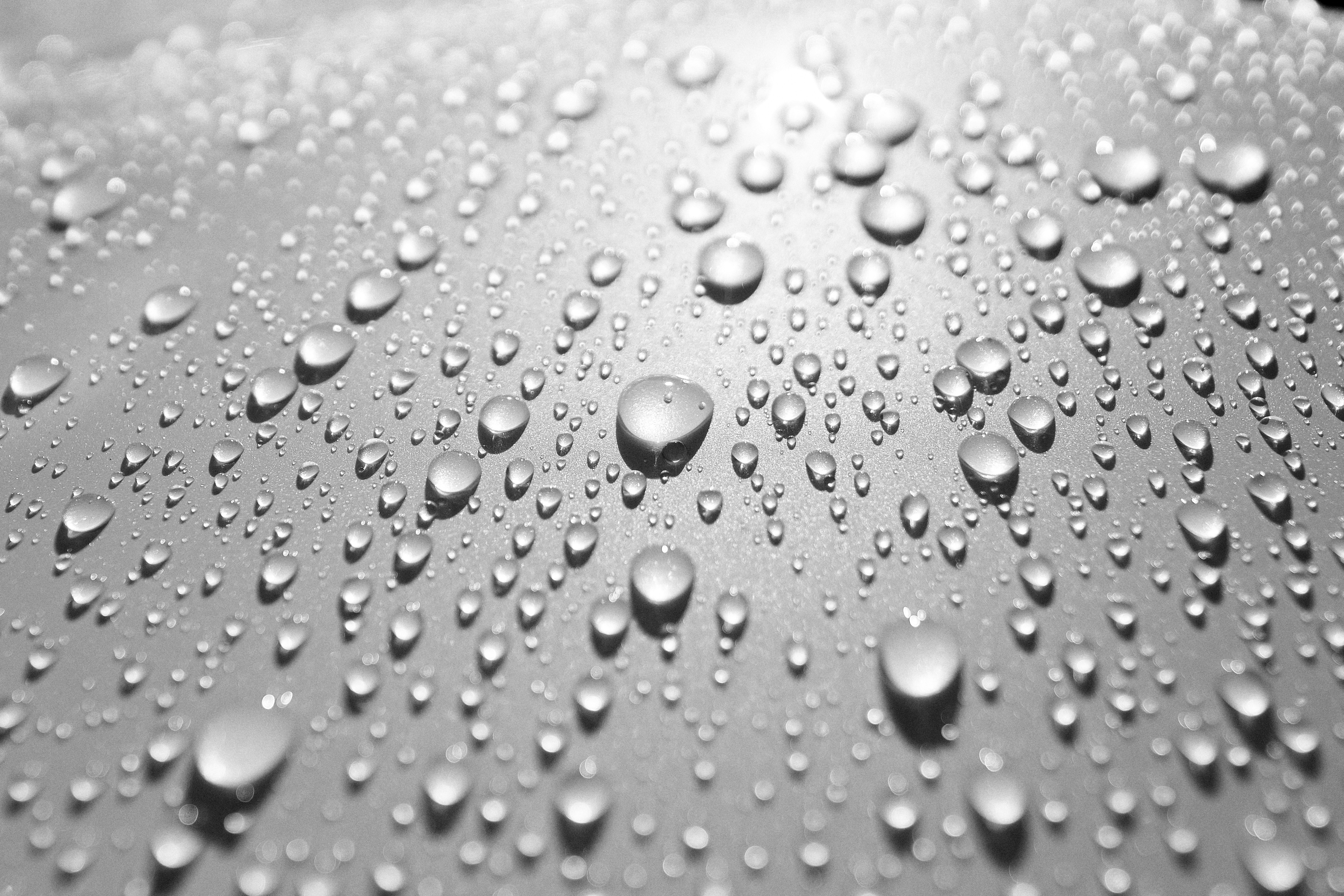 Close-up of water droplets on a metallic surface.