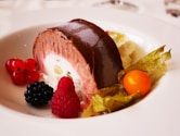 Chocolate roll cake with berries and cream
