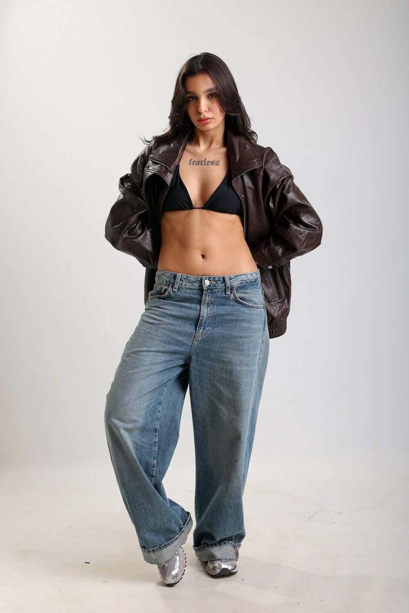 Leather jacket with baggy jeans