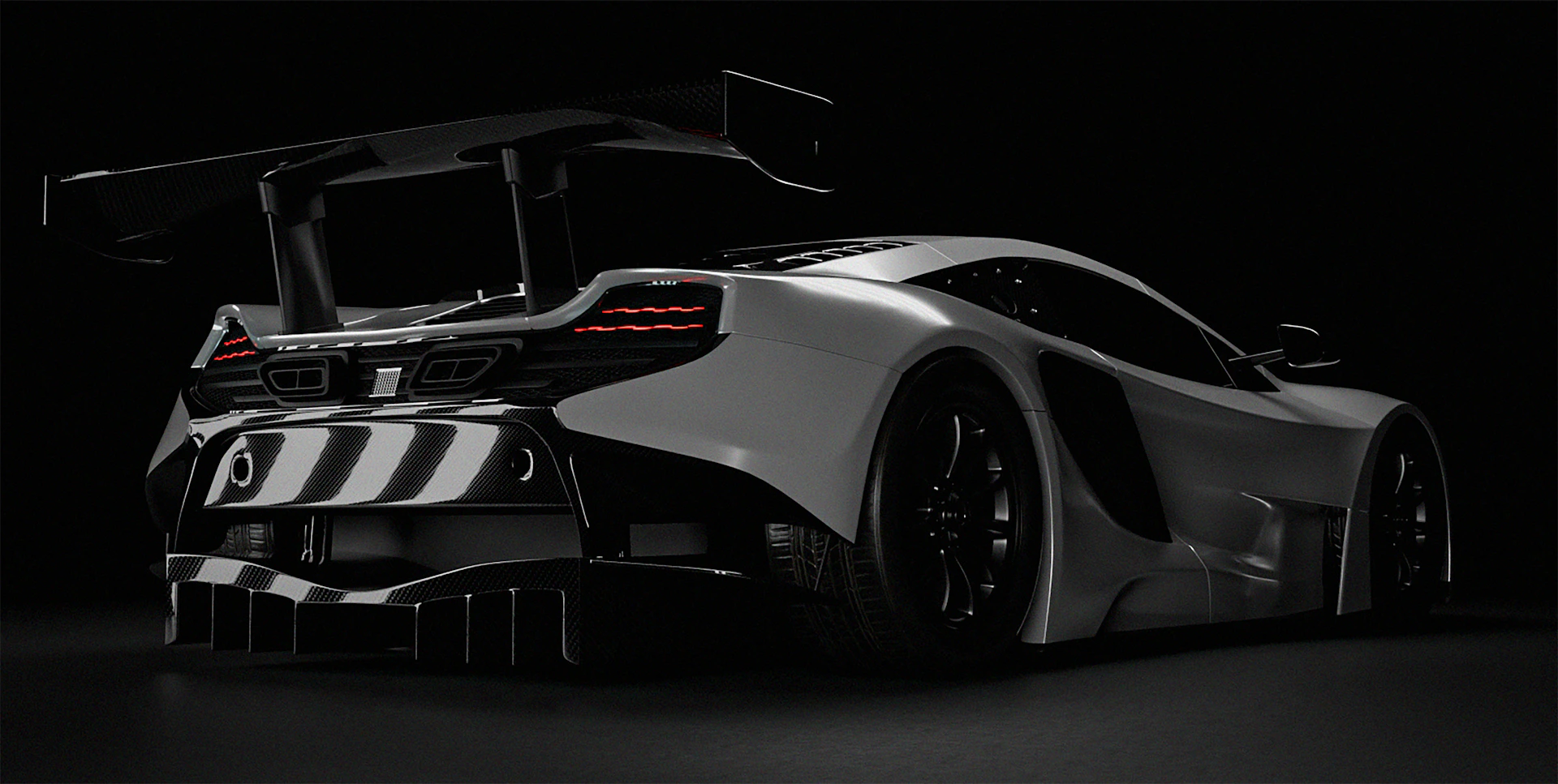 A sleek white sports car with a large spoiler