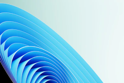 Abstract blue paper curves forming a spiral pattern.