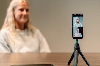 Woman on video call with two people