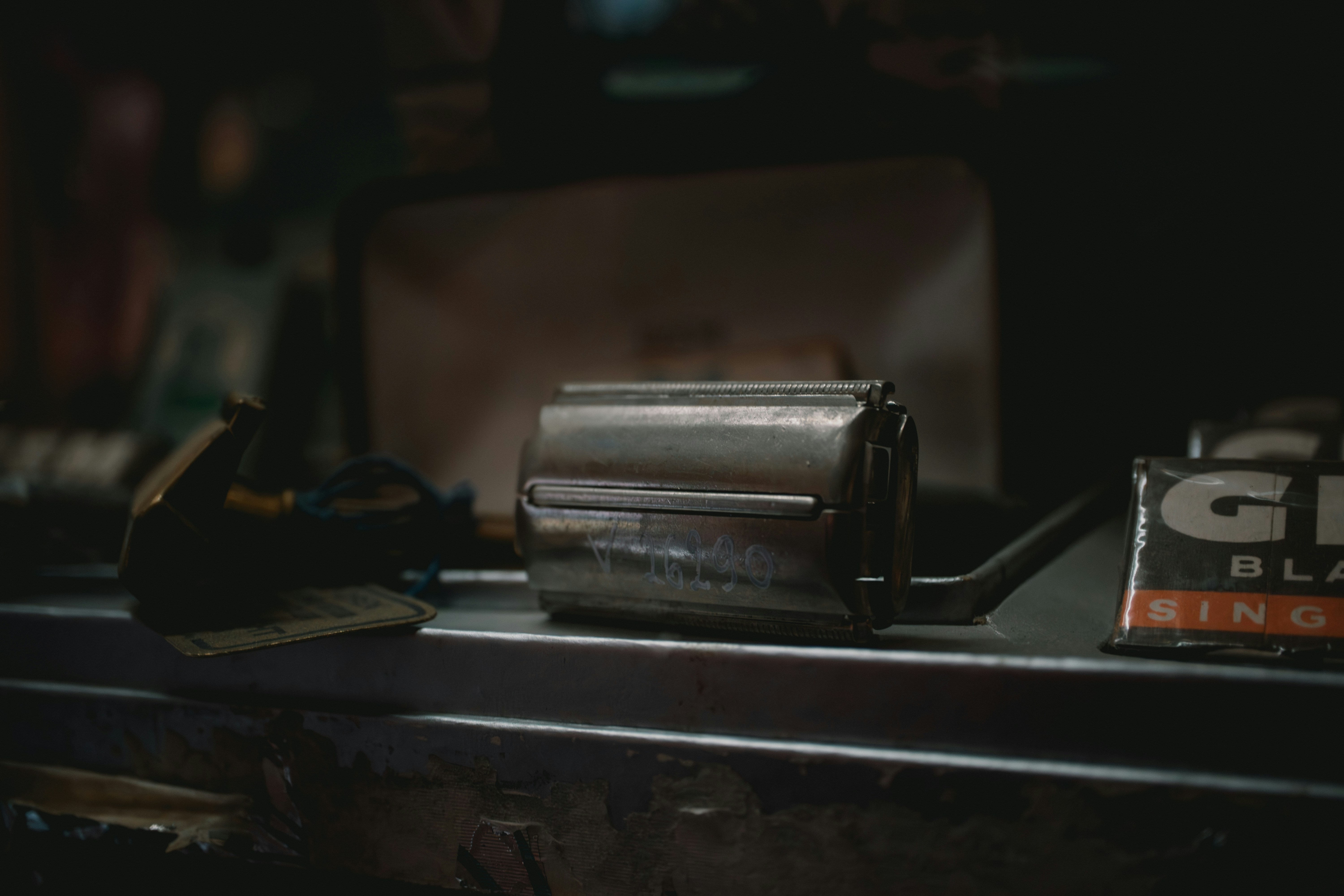 Vintage razor and grooming items on shelf