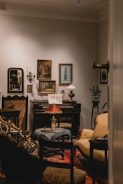 Antique living room with piano and artwork