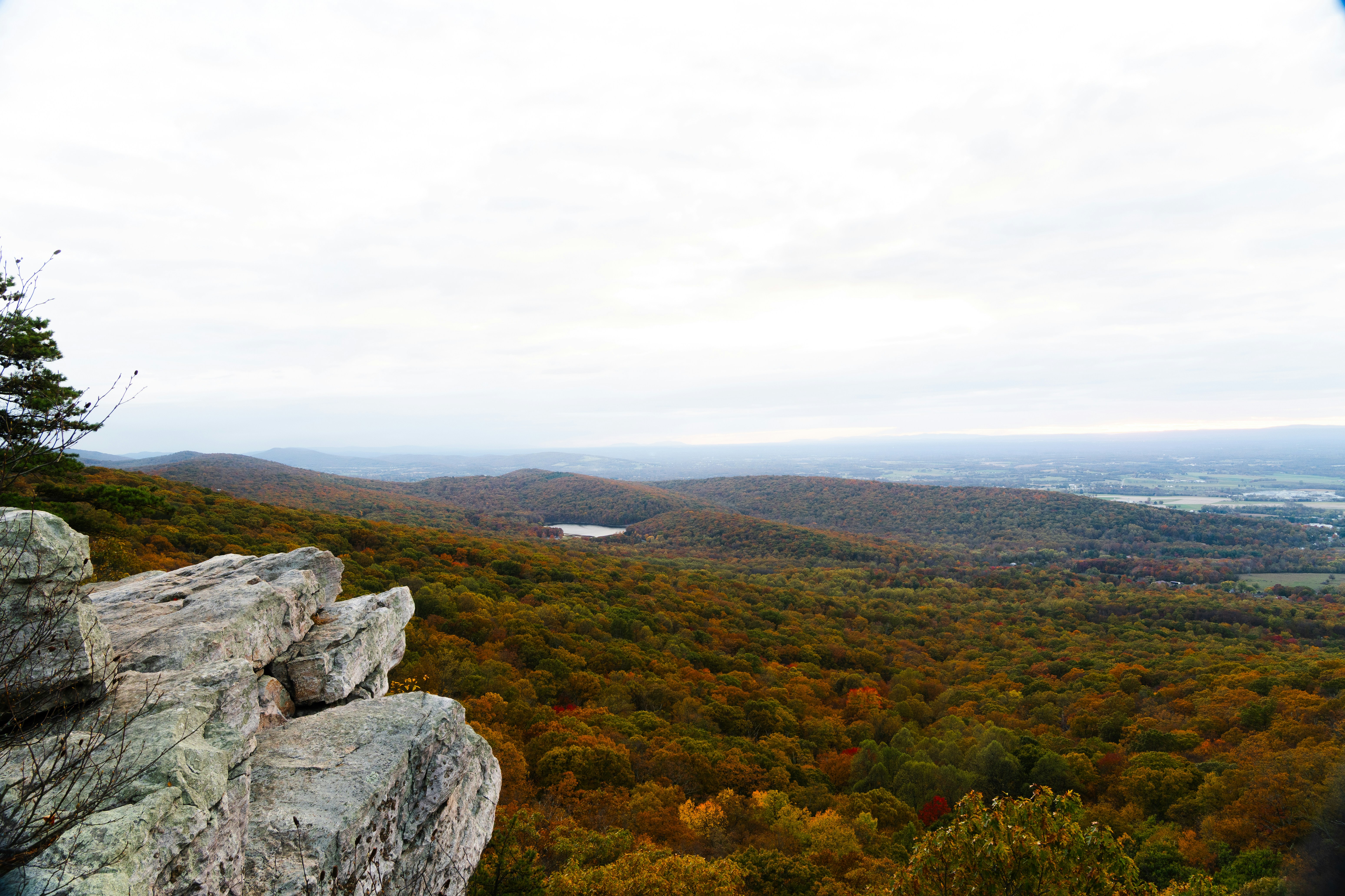 Rocky overlook with colorful autumn forest below