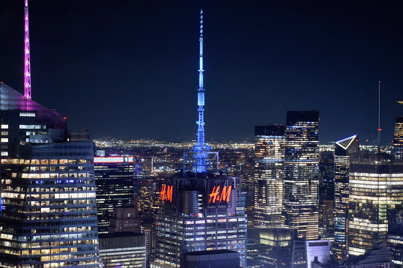 Skyscrapers illuminated at night with city lights
