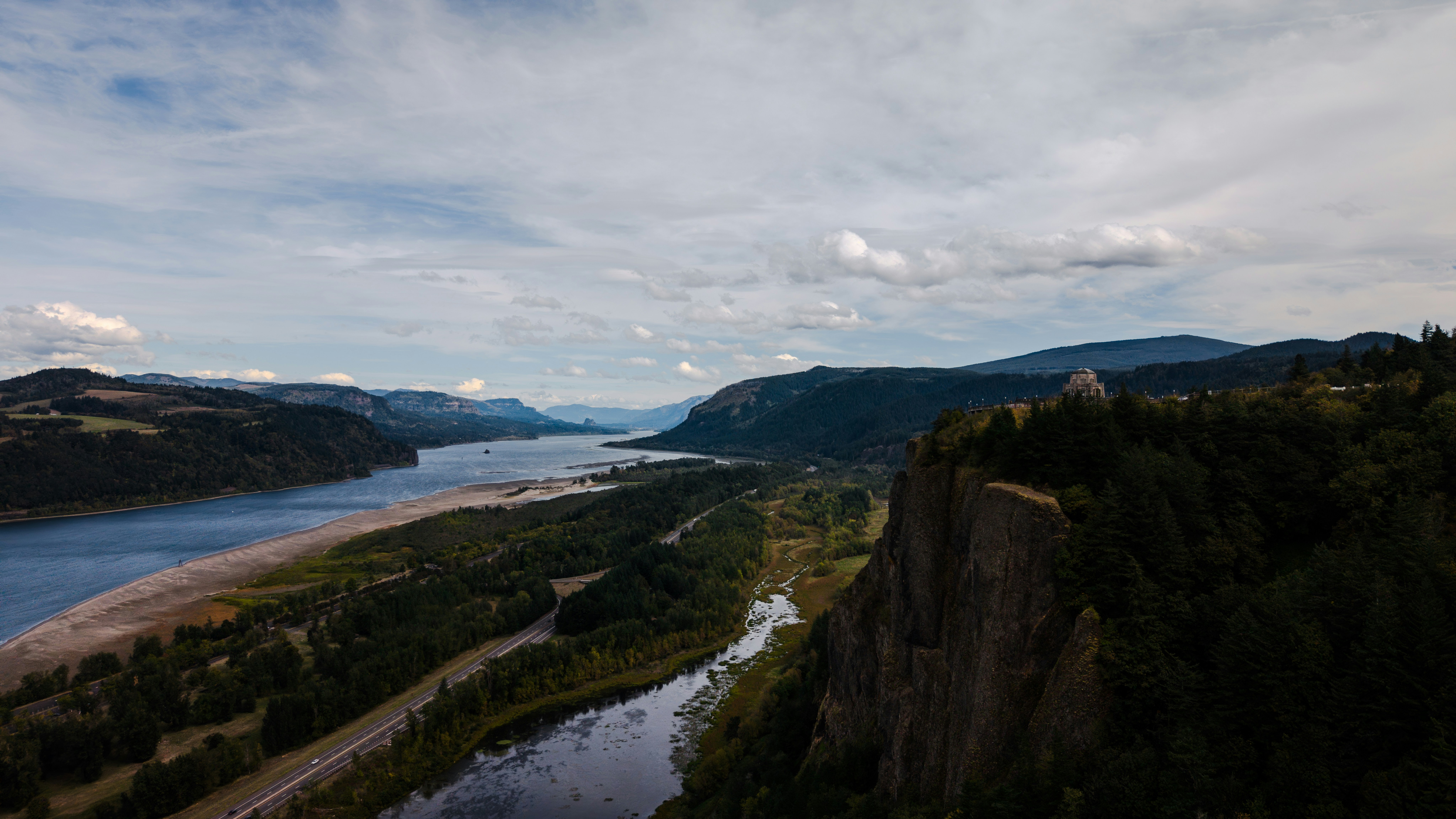 Wide river flowing through a lush green valley