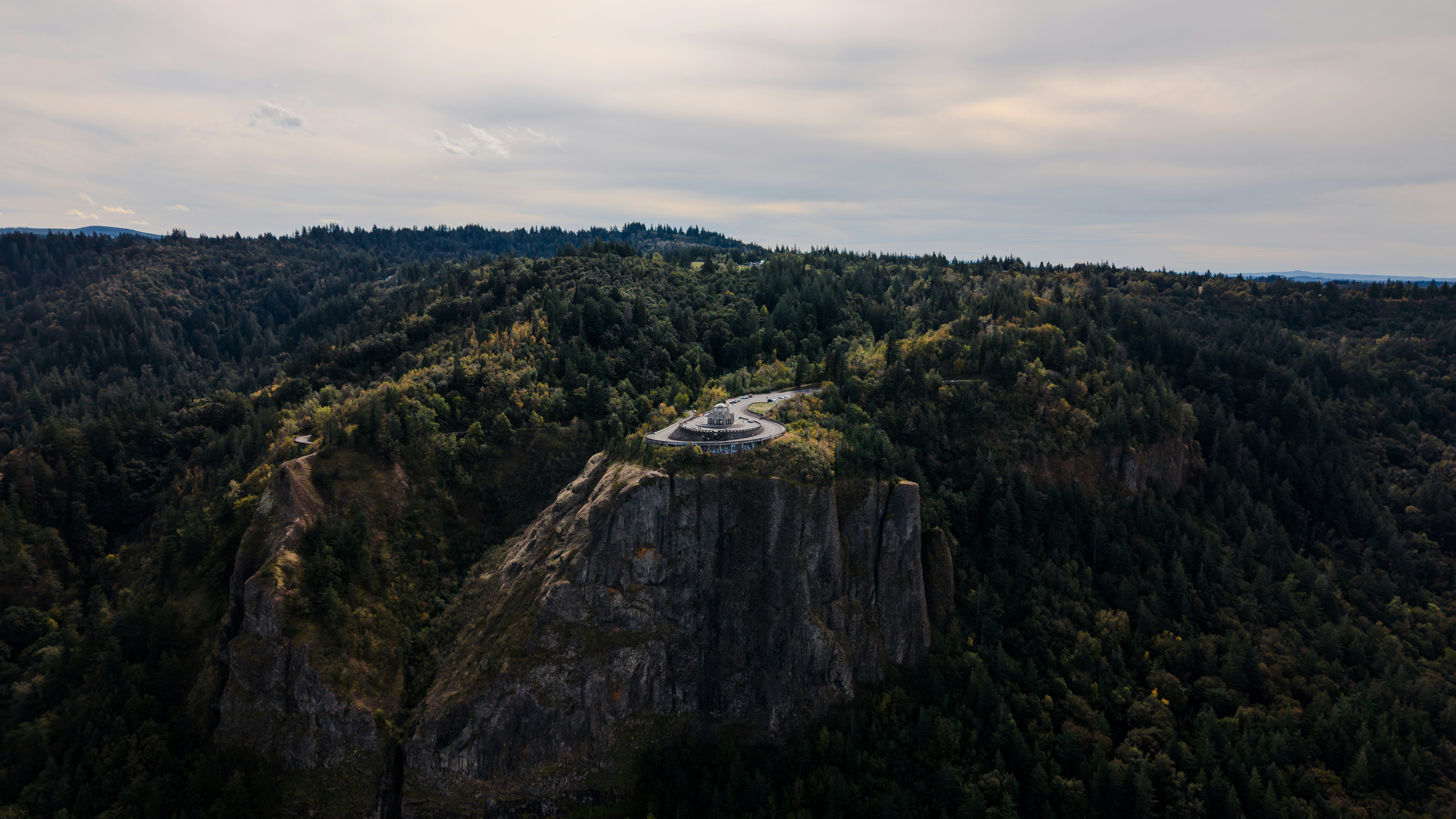 Cliffside viewpoint overlooking a forested valley