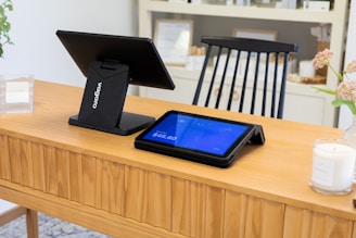 Point of sale system on a wooden counter.