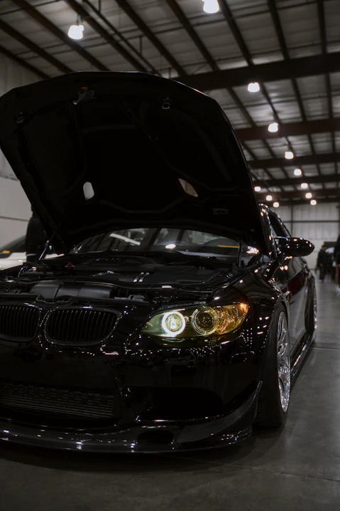 Engine bay close-up of a BMW vehicle, highlighting the demand for highstrength lightweight materials