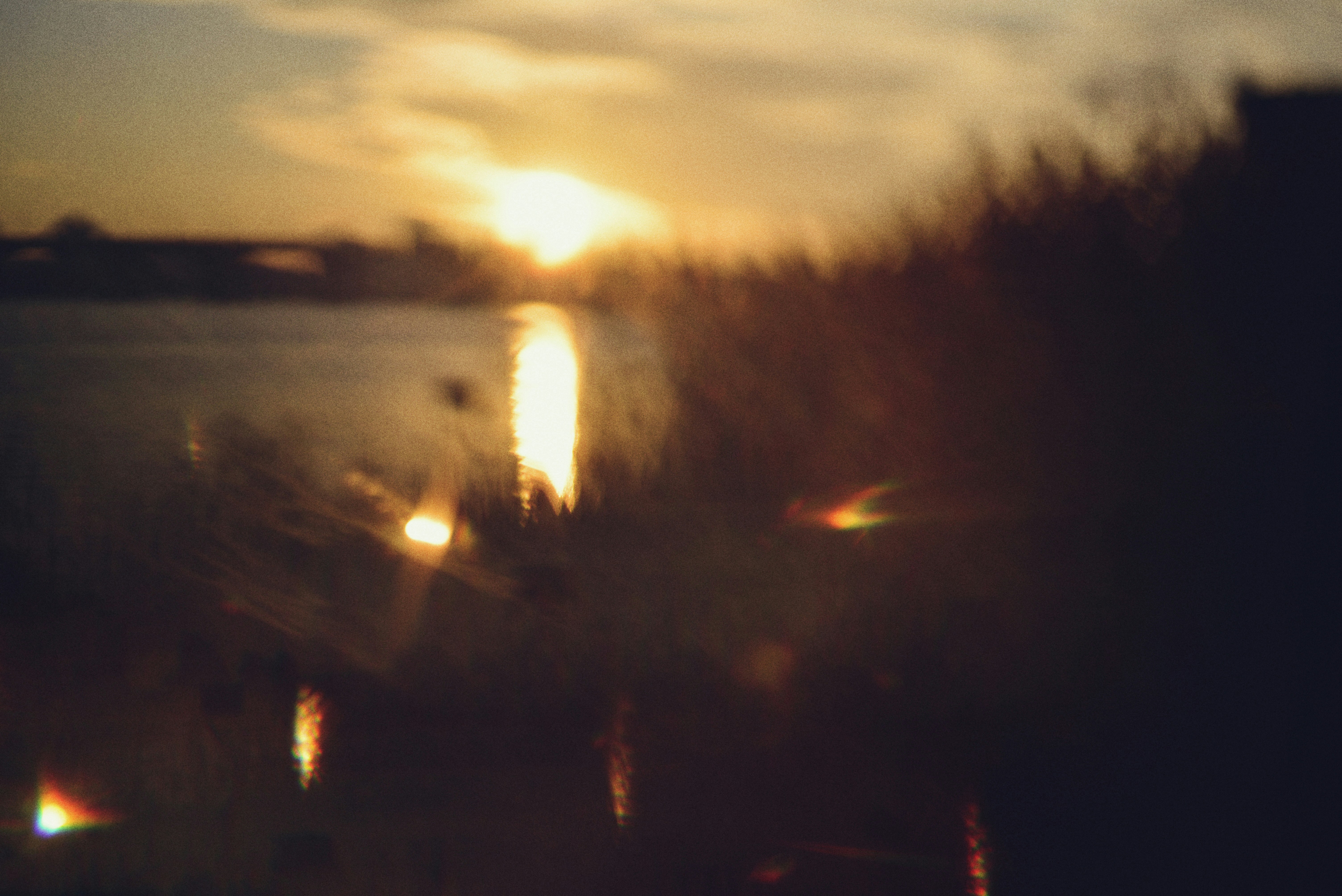 Sunset over a calm body of water.