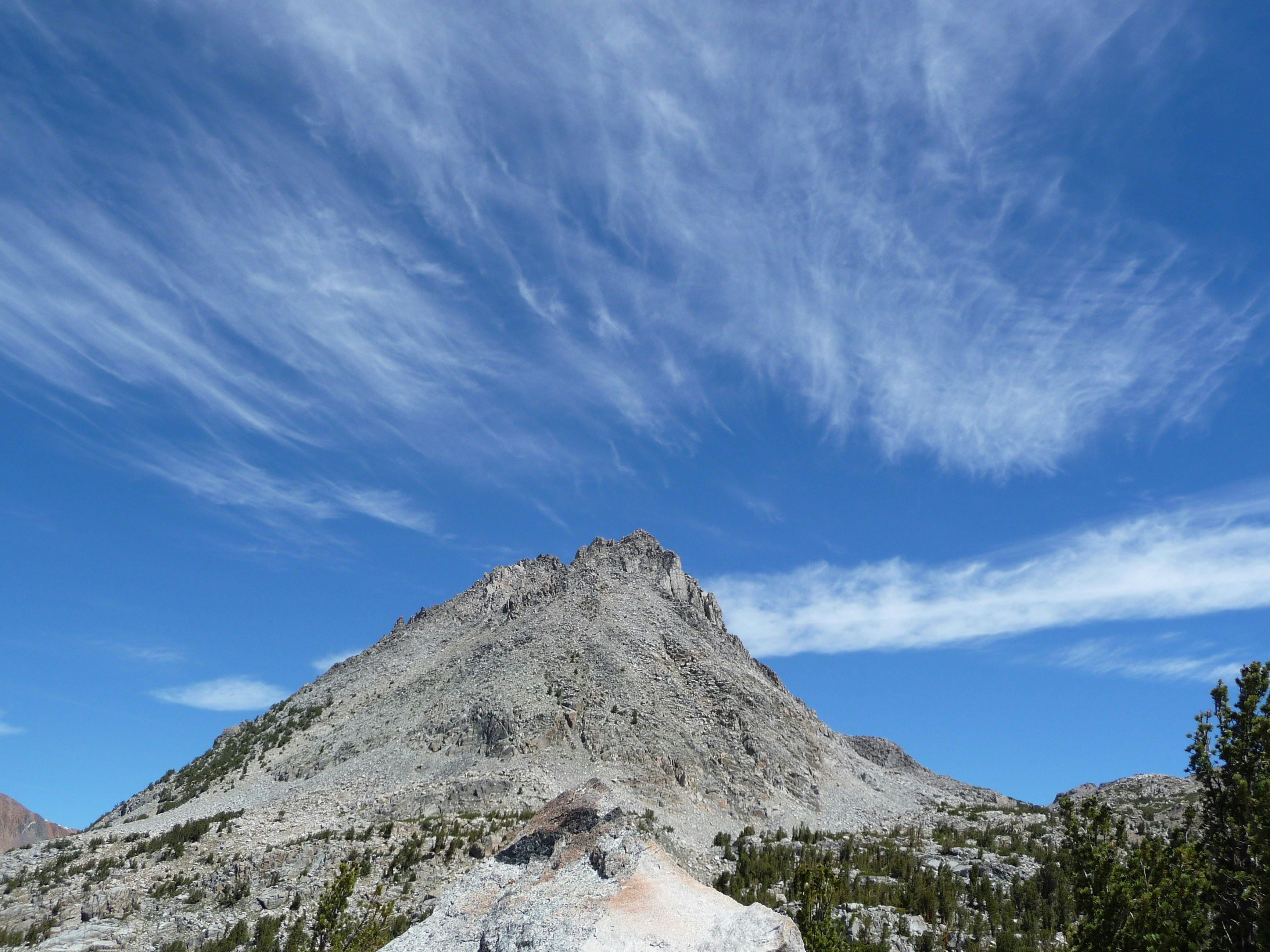 Rocky mountain peak under a bright blue sky