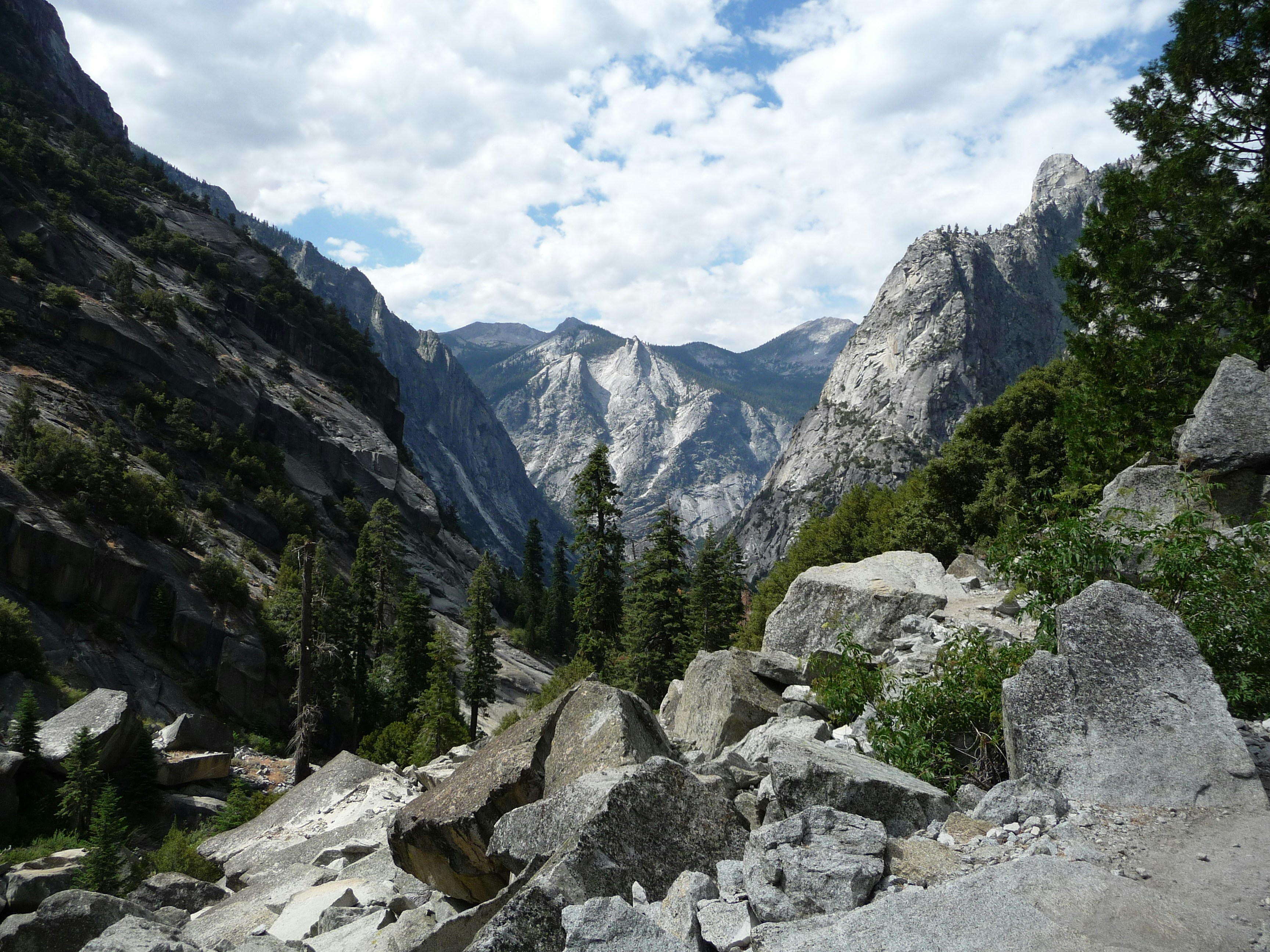 Rocky canyon with steep granite walls and trees.