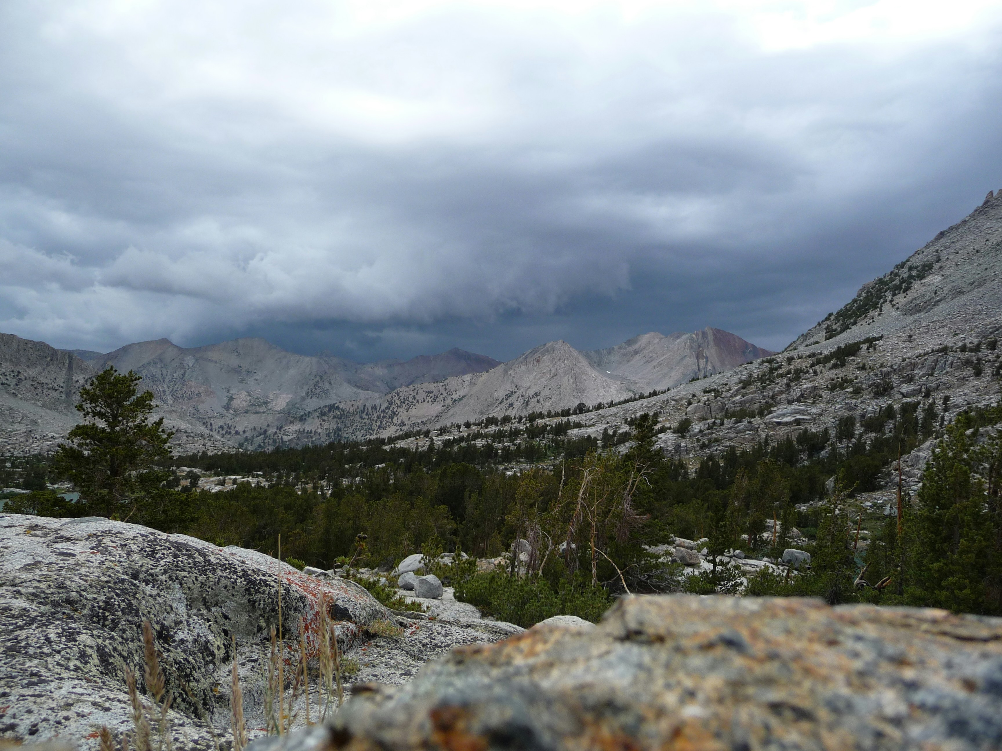 Mountain landscape under stormy grey clouds