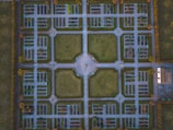 Aerial view of a formal garden with symmetrical paths.