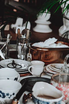 Assortment of vintage dishes and kitchenware on a table.