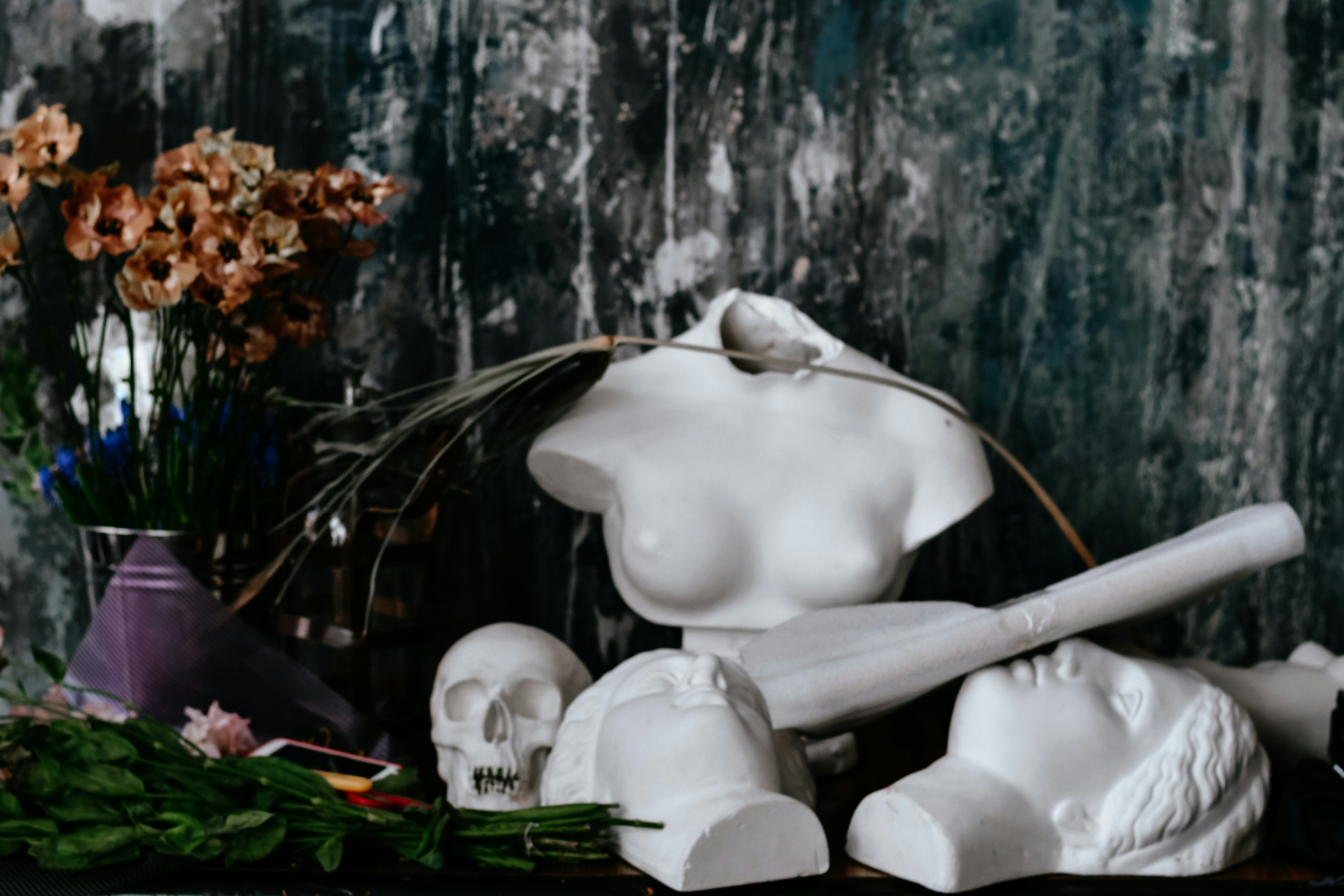 Art studio with sculptures and flowers