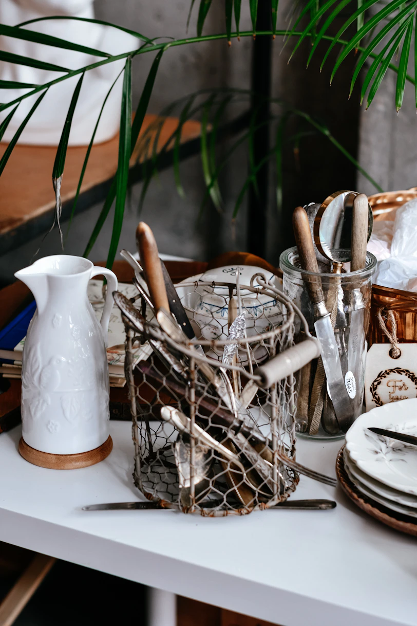 Kitchen utensils in wire holder with white pitcher