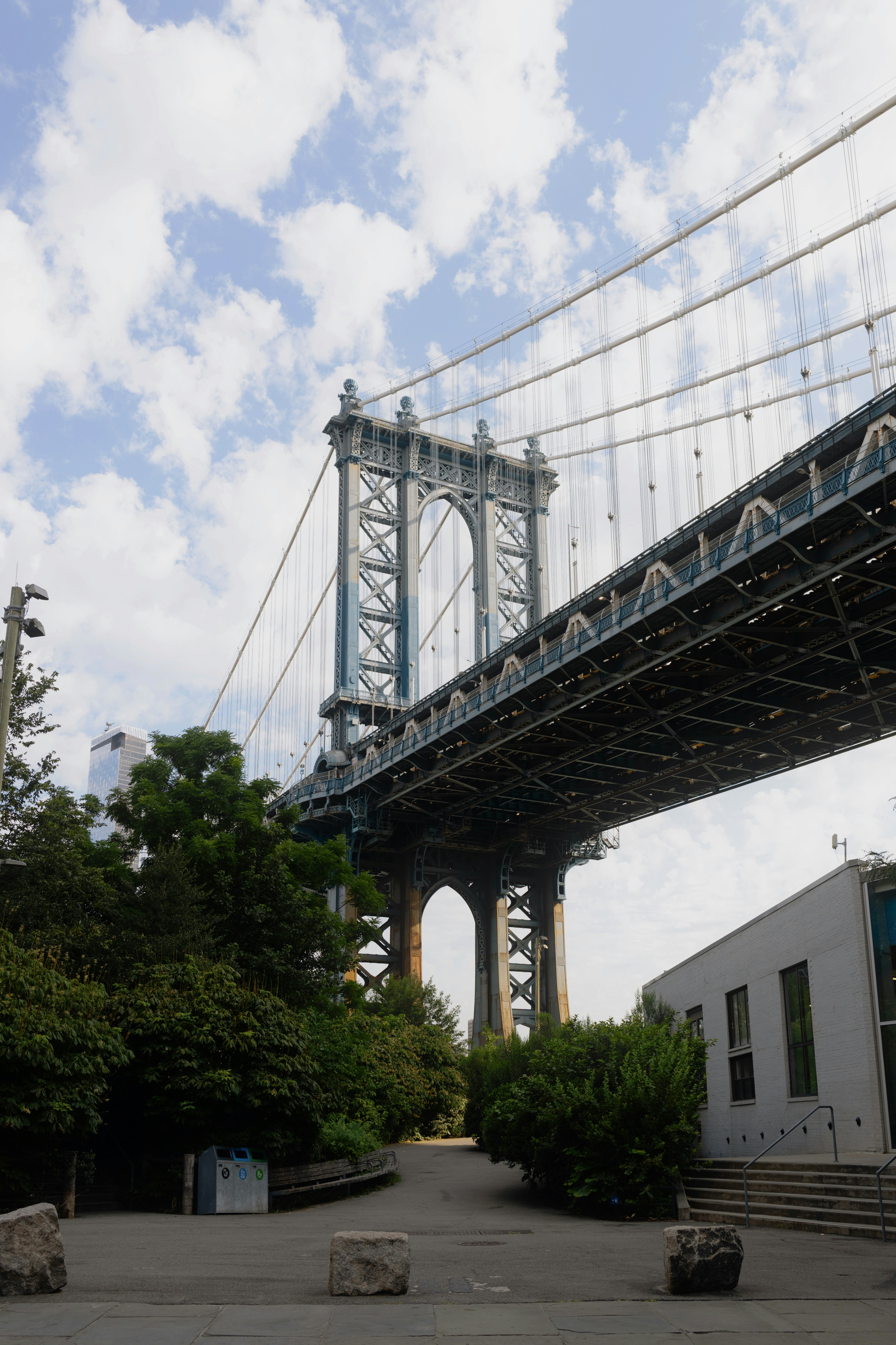The manhattan bridge under a cloudy sky