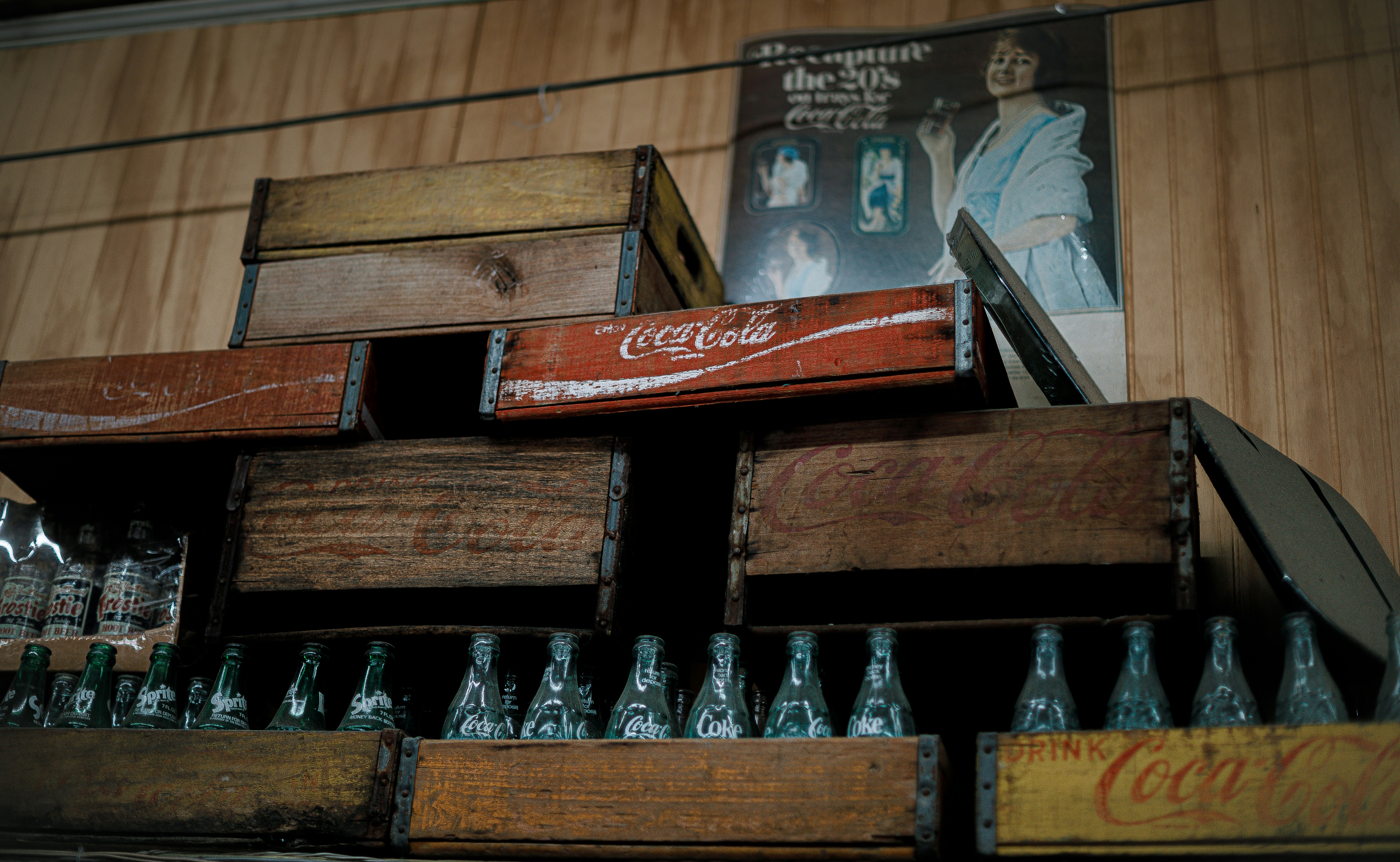 Vintage coca-cola crates stacked with bottles