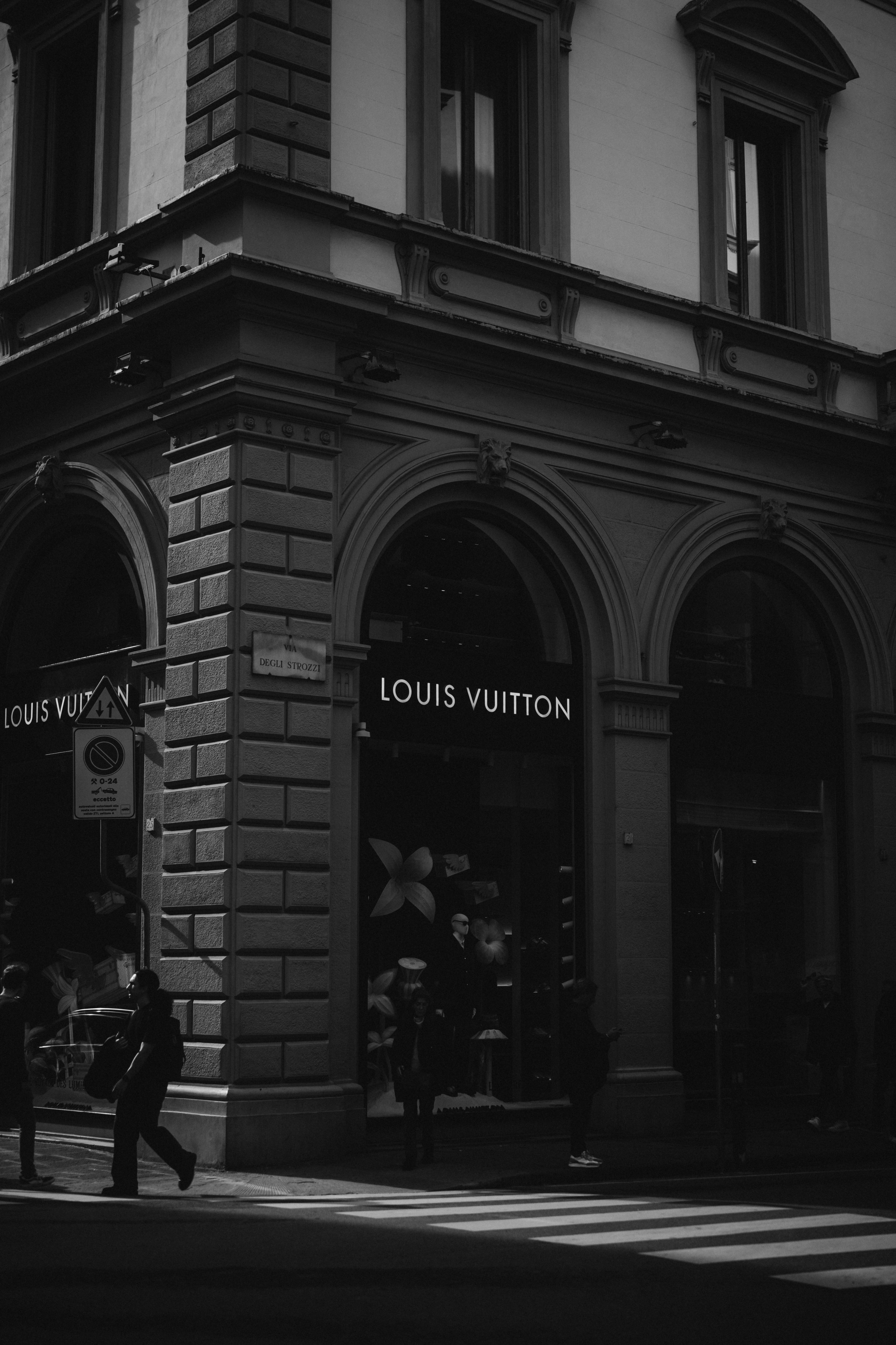 Louis vuitton store on a city street corner.