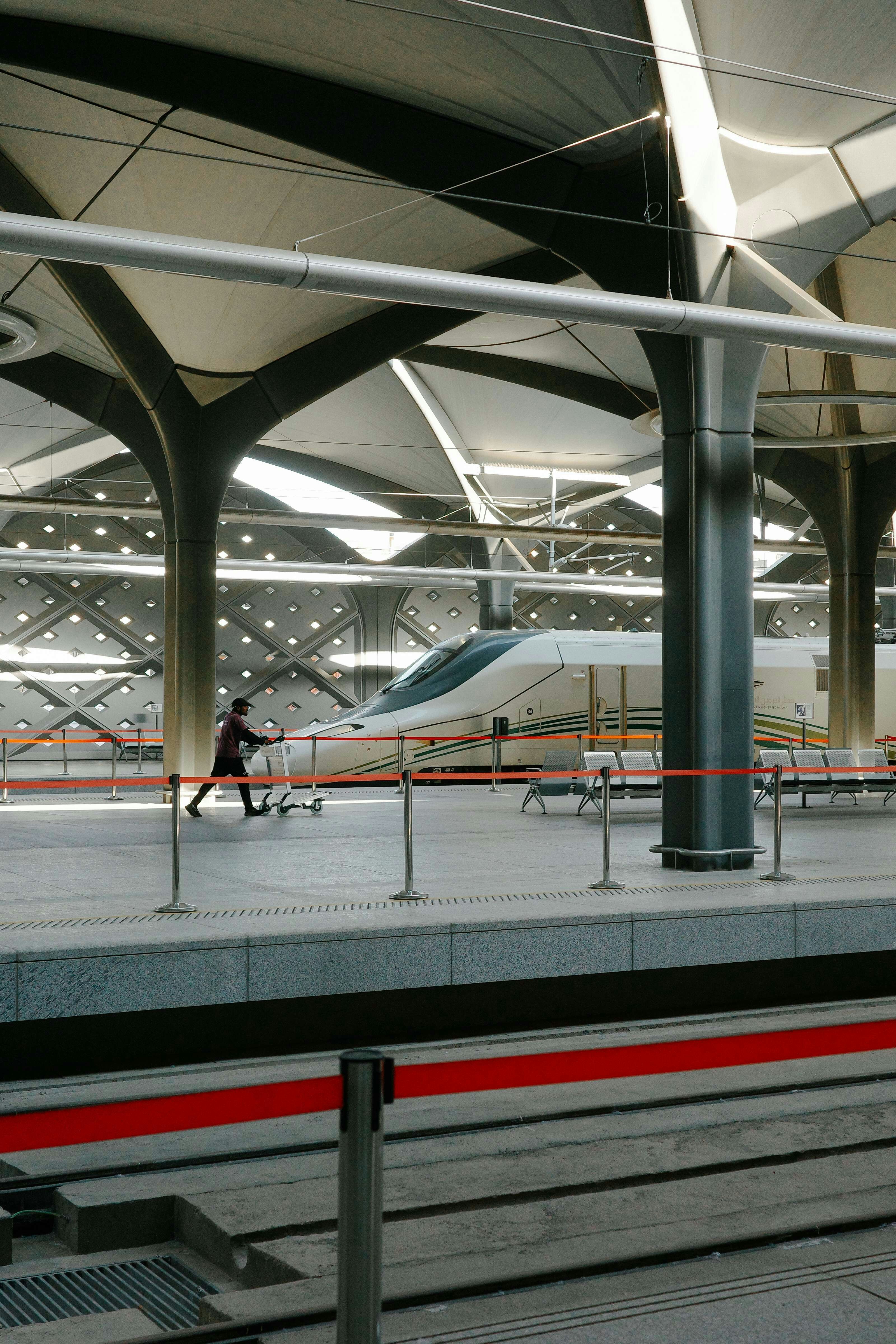 Person running on a modern train station platform. photo – Free Travel ...