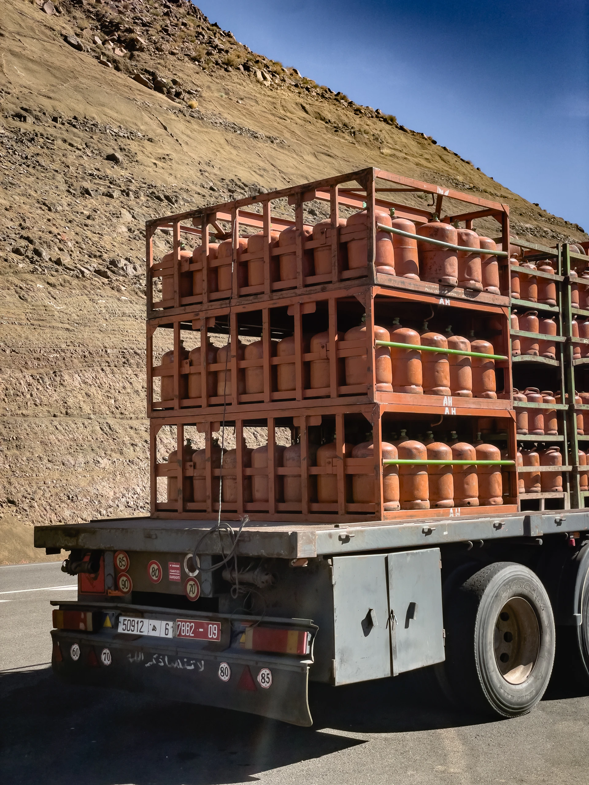 Delivery truck carrying propane cylinders on the road