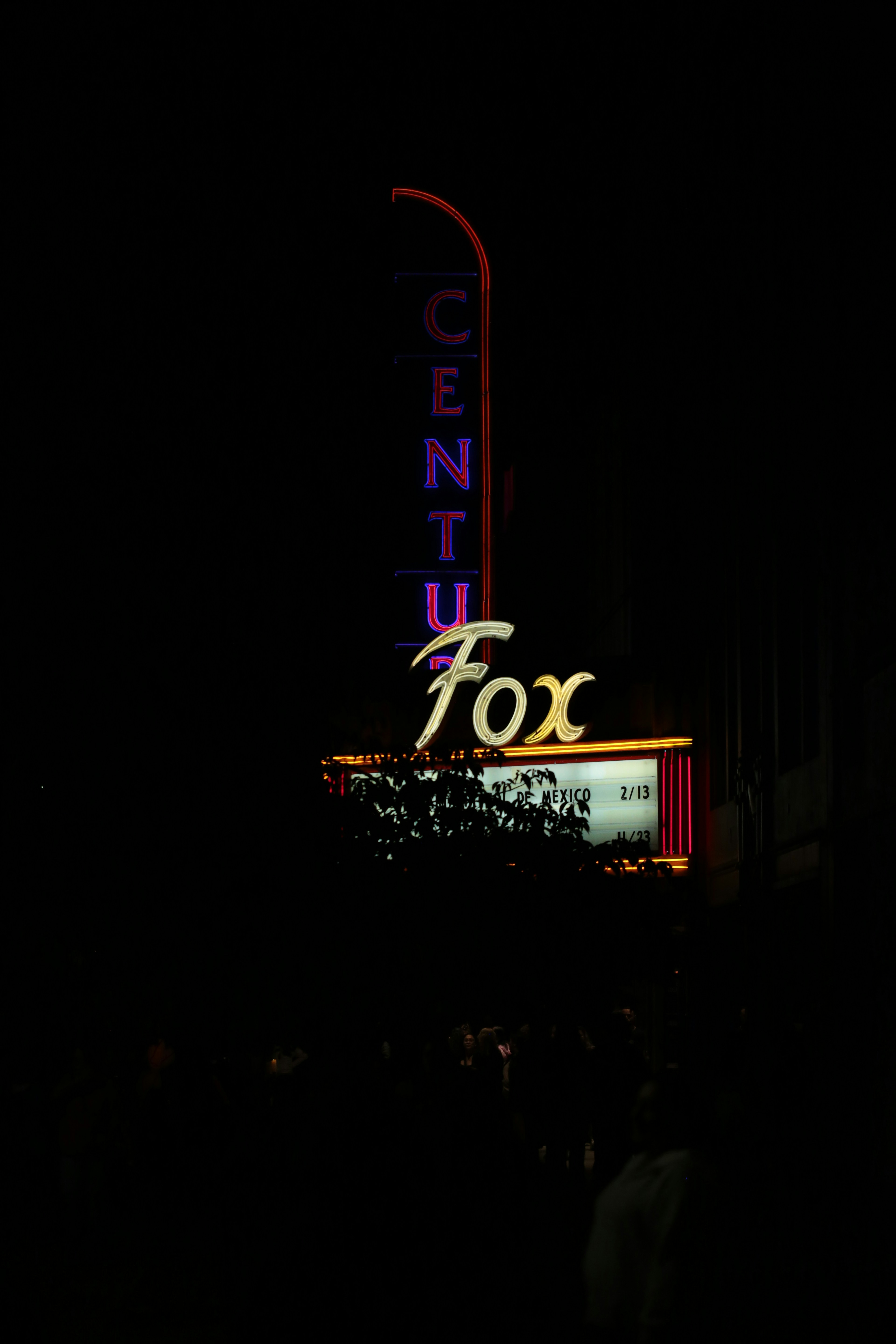 Neon sign for century fox theater at night