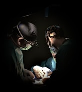 Surgeons performing surgery under bright lights