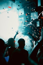 Confetti falling on a crowd at a concert.