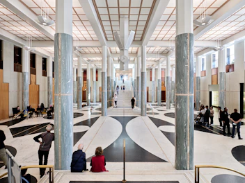 Grand hall with columns and people