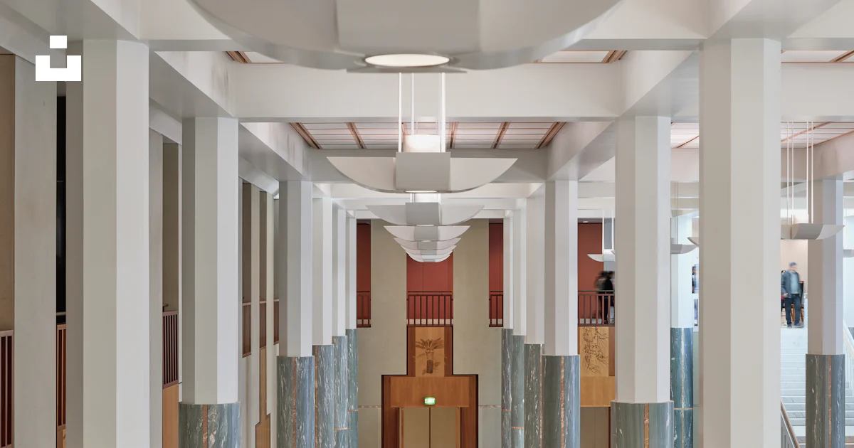 Modern hall with marble columns and geometric floor patterns. photo ...
