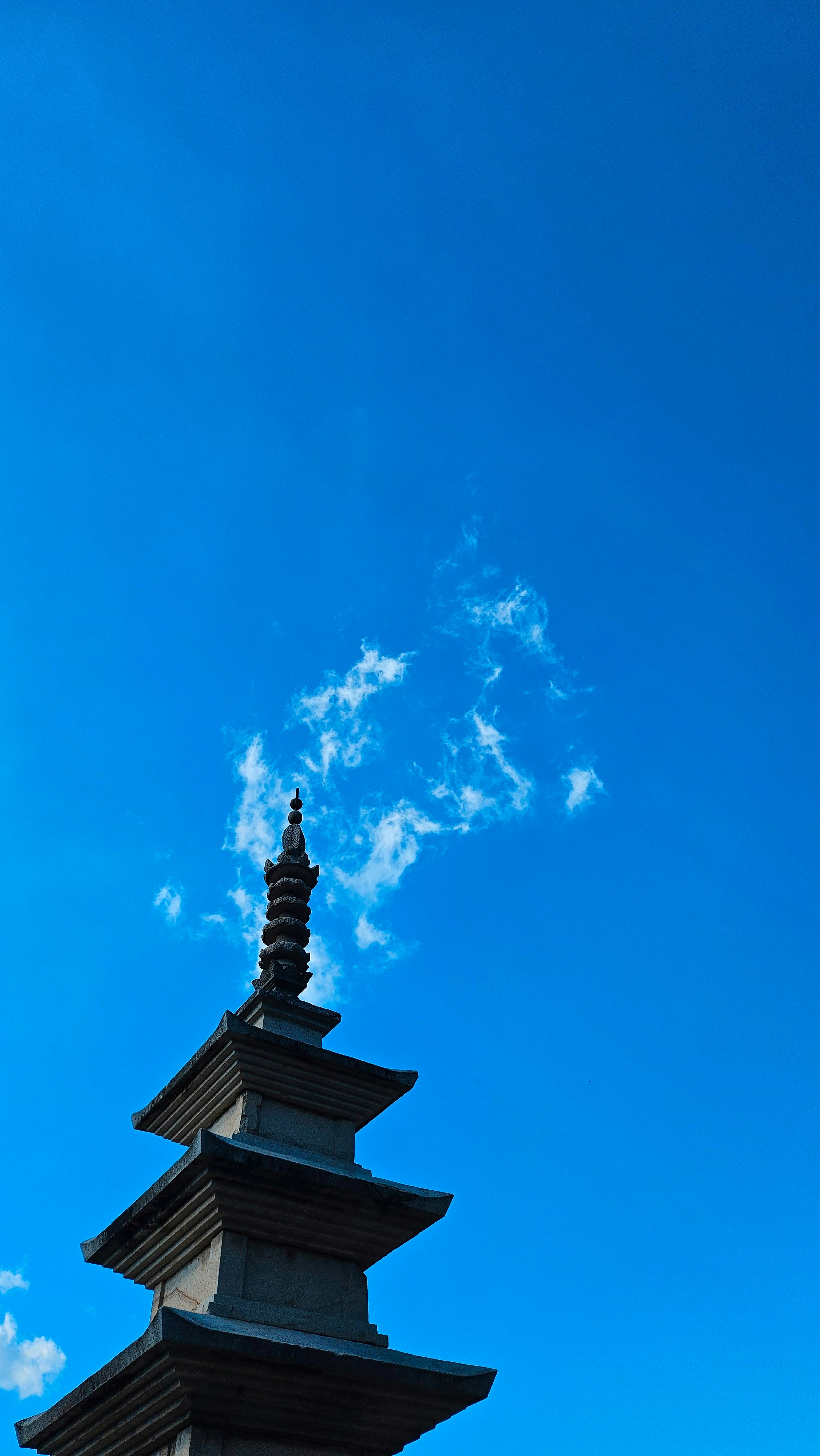 Stone pagoda against a clear blue sky