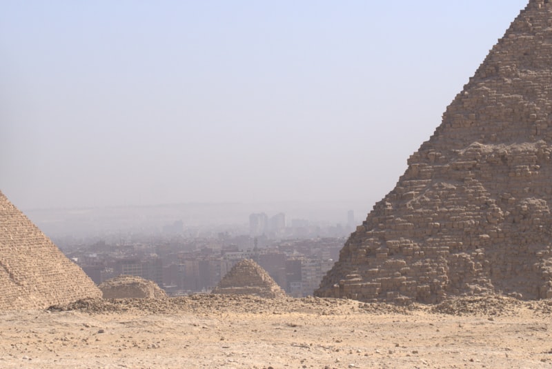 Pyramids of Giza with the Cairo skyline on the horizon