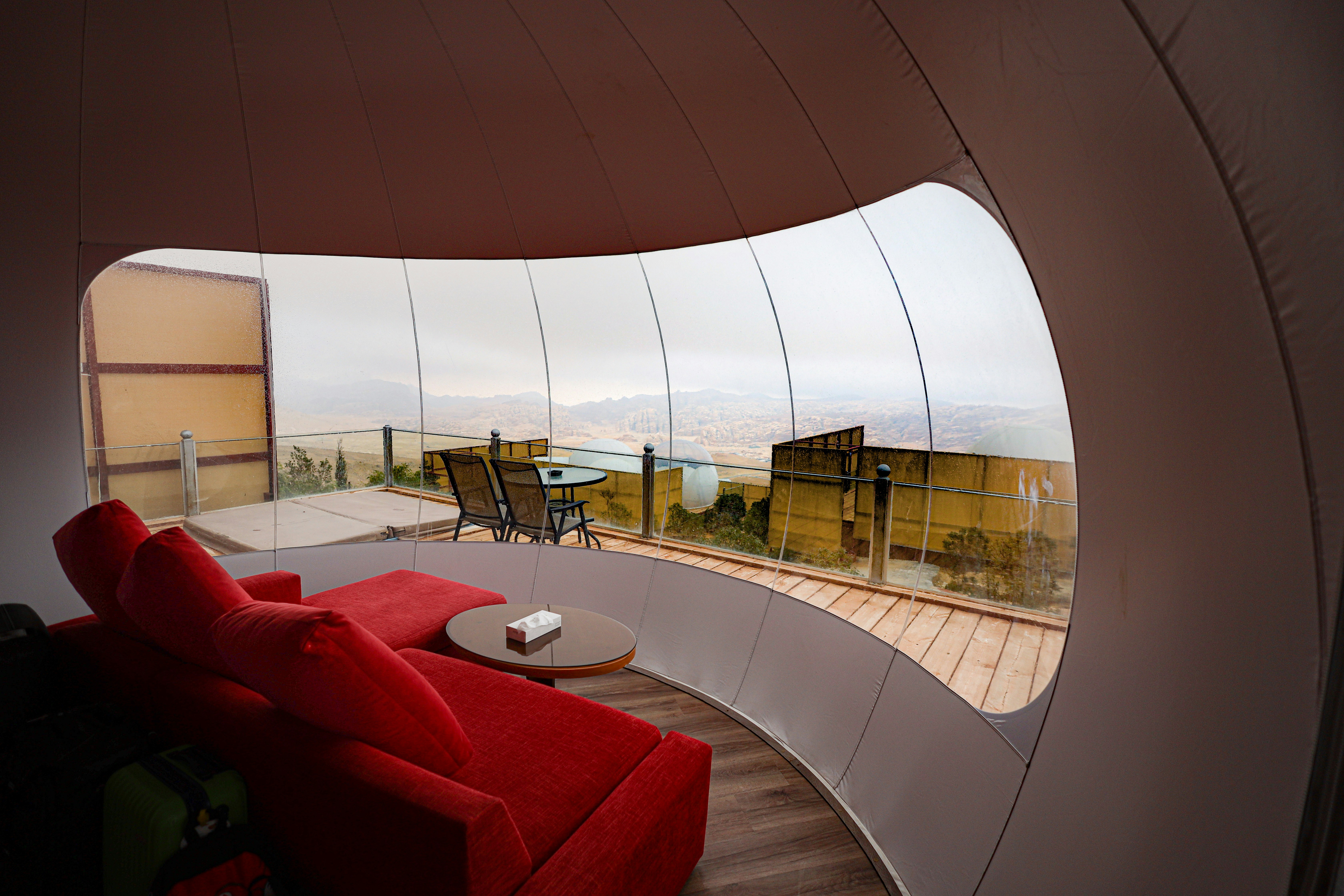 Modern living space with outdoor pool overlooking landscape