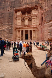 Tourists gather at the treasury in petra, jordan.
