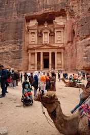 Tourists gather at the treasury in petra, jordan.
