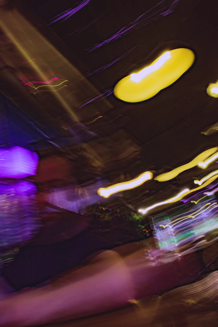 Blurred abstract lights and shapes in a dark setting
