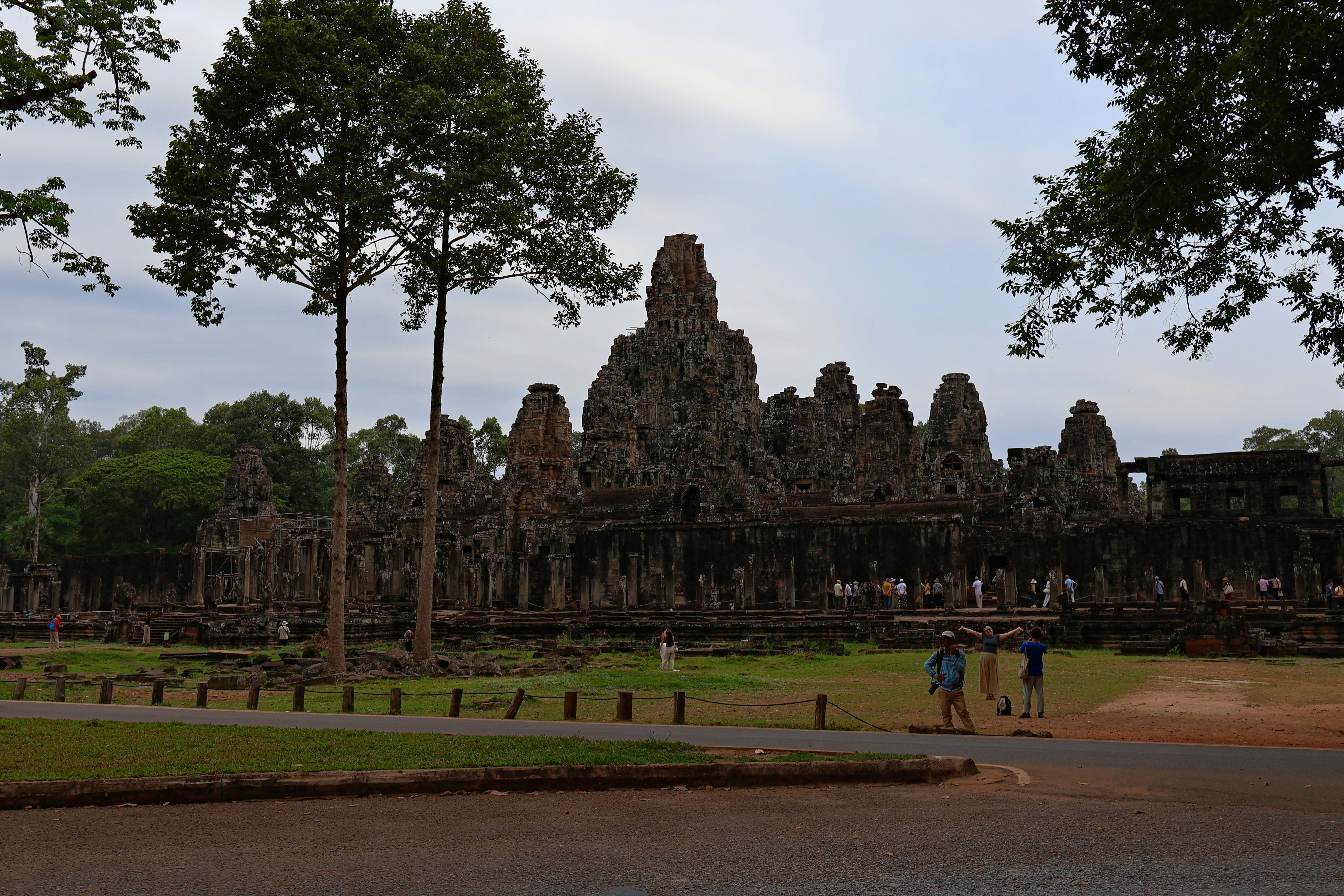 Ancient stone temple with intricate carvings and trees