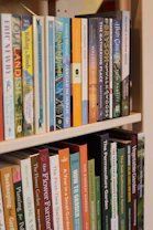 A bookshelf filled with various books.